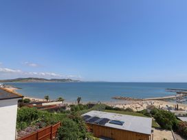 A view of the beach and sea at 3 Harbour Heights in Lyme Regis