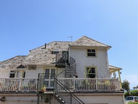 A house with a staircase and balcony at 3 Harbour Heights Lyme Regis