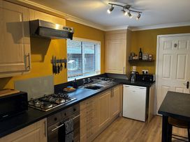 A kitchen with countertop and appliances at 22 Two Little Ducks, Lynton