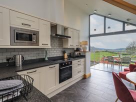 A kitchen with a view of the outdoors at Haystacks in Troutbeck