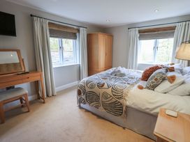 A bedroom with a bed and dresser at Haystacks in Troutbeck