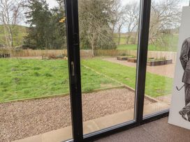 A garden view from inside a property at Honeysuckle Cottage Crookham near Cornhill-On-Tweed