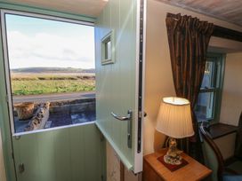 An entrance with a door open to a view at 2 Strand Cottages in Carmarthen