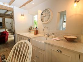 A kitchen with a sink and counter at 8 Gloucester Street in Winchcombe