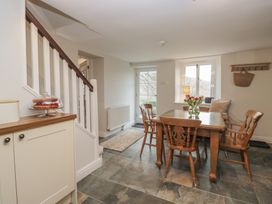 A dining room with a table and chairs at Brockstones Grasmere