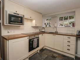 A kitchen with cabinets and appliances at Brockstones in Grasmere