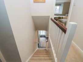 A staircase leading down to a doorway at Brockstones in Grasmere