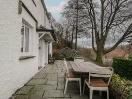 An outdoor area with a table and chairs at Brockstones in Grasmere