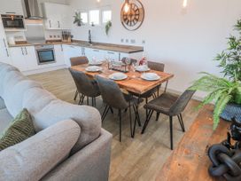 A dining room with a table set for dinner at Bay View in Portreath