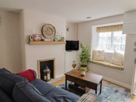 A living room with a sofa and coffee table at 6 Bedford Place in Bridport