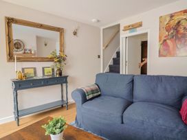 A living room with a sofa and table at 6 Bedford Place in Bridport