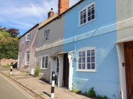 A house with blue and grey walls on a street at 6 Bedford Place Bridport