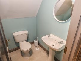 A bathroom with a toilet and sink at No.3 Beach Cottages, Keel, County Mayo