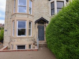 A house entrance with a front door and windows at The Corner House in Scarborough