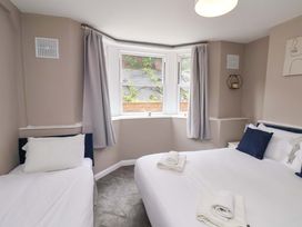 A bedroom with a double bed and a single bed at The Corner House in Scarborough