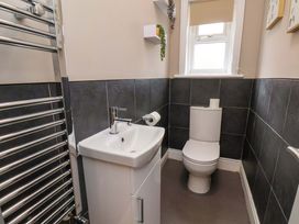A bathroom with a sink and toilet at The Corner House in Scarborough
