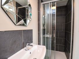A bathroom with a sink and a shower at The Corner House in Scarborough
