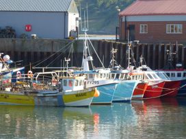 Fishing boats at a harbor near The Corner House Scarborough
