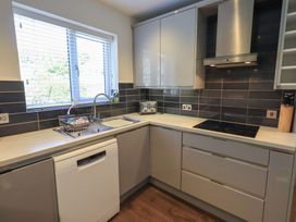 A kitchen with a sink and dishwasher at Waterfall in Ambleside