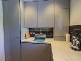 A kitchen with cabinets and countertop at Waterfall in Ambleside