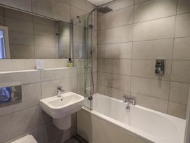 A bathroom with a bathtub and a sink at Waterfall in Ambleside