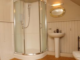 A bathroom with a shower and sink at Orchard Barn Wexford