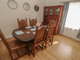 A dining room with a table and chairs at 28 Guildford Road