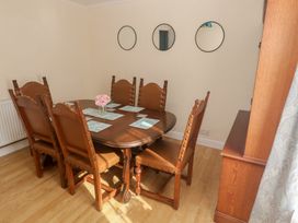 A dining room with a table and chairs at 28 Guildford Road