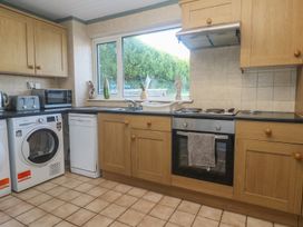 A kitchen with appliances and a sink at 28 Guildford Road