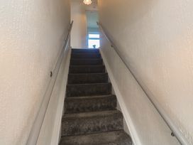 A staircase leading to a window at 28 Guildford Road