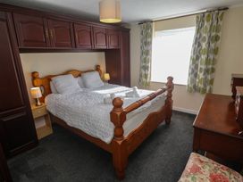 A bedroom with a bed and furniture at 28 Guildford Road