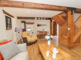 A living room with a sofa and coffee table at The Bull Pen in Yeovil, Somerset
