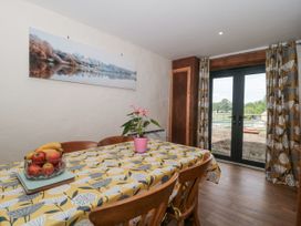 A dining room with a table and chairs at The Bull Pen in Yeovil, Somerset