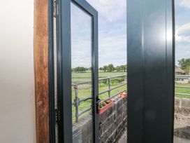 A balcony view with door and potted plants at The Bull Pen Yeovil, Somerset