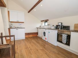 A kitchen with appliances and cabinets at The Bull Pen Yeovil Somerset