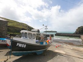 A fishing boat at the harbor at Rowena in Mullion