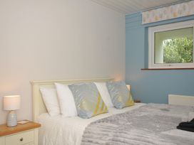 A bedroom with a bed and pillows at 37 Tamar St Ann's Chapel near Callington