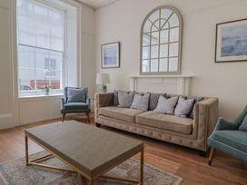 A living room with a sofa and coffee table at FLAT 1 53a Broad Street (1 Bedroom Sleeping 2) Lyme Regis