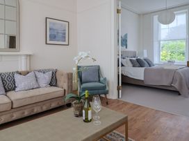 A living room with a sofa and coffee table at FLAT 1 53a Broad Street (1 Bedroom Sleeping 2) Lyme Regis