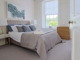 A bedroom with a bed and chest of drawers at FLAT 1 53a Broad Street (1 Bedroom Sleeping 2) Lyme Regis