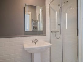 A bathroom with a sink and shower at FLAT 1 53a Broad Street (1 Bedroom Sleeping 2) Lyme Regis