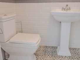 A bathroom with a toilet and sink at FLAT 1 53a Broad Street (1 Bedroom Sleeping 2) Lyme Regis