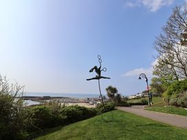 A sculpture on grass near the sea at FLAT 1 53a Broad Street (1 Bedroom Sleeping 2) Lyme Regis