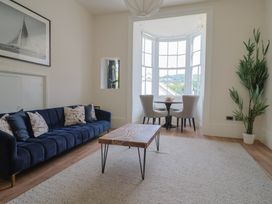 A living room with a sofa and coffee table at Saltwind in Lyme Regis