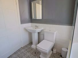 A bathroom with a sink and toilet at Pebble Cove in Lyme Regis