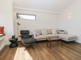 A living room with a sofa and coffee table at Driftwood Cottage in Ulverston