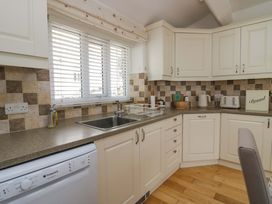 A kitchen with a sink and countertop at Hollens Cottage in Grasmere