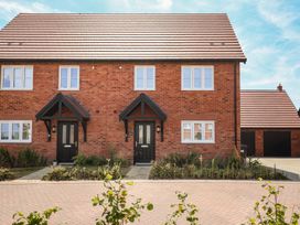A brick house with two entrances and a garden at Inishnee House in Shotley Gate