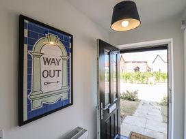 An entrance with a door and a sign at Inishnee House in Shotley Gate
