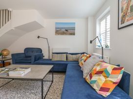 A living room with a sofa and coffee table at Inishnee House in Shotley Gate
